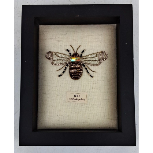 100 - Framed decorative beaded bee art. Features an intricately designed bee labeled “Anthophila,” with mu... 