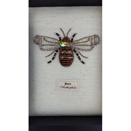 100 - Framed decorative beaded bee art. Features an intricately designed bee labeled “Anthophila,” with mu... 