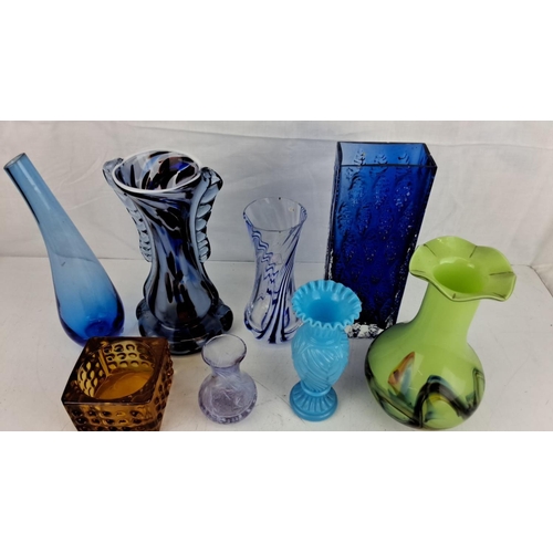 11 - Collection of eight assorted vintage glass vases in various colors and designs, including blue, ambe... 