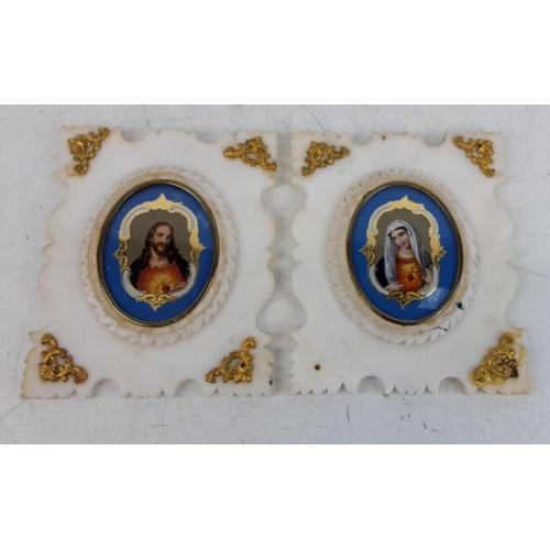 123 - Pair of religious icons in white marble frames with gold detailing, featuring portraits of the Sacre... 
