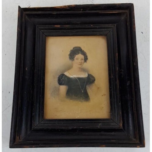 125 - An antique framed watercolour portrait of a woman. The artwork features detailed attire and delicate... 