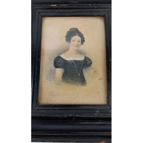 125 - An antique framed watercolour portrait of a woman. The artwork features detailed attire and delicate... 