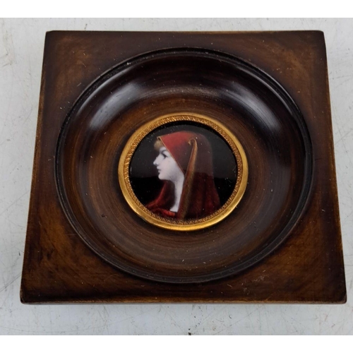 130 - Framed miniature enamel portrait of a woman in a red cloak. Painted on porcelain, with a wooden and ... 