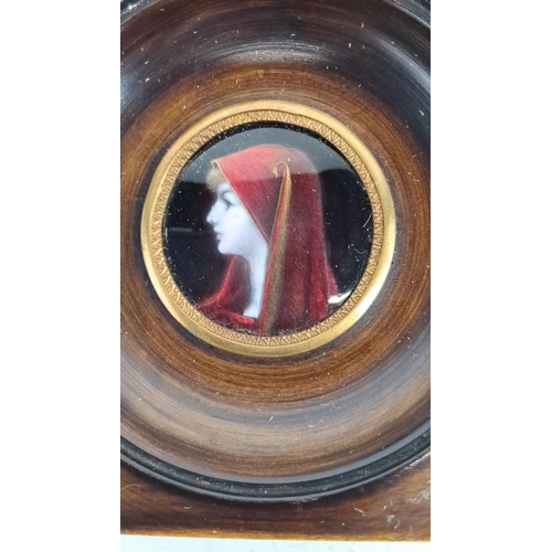 130 - Framed miniature enamel portrait of a woman in a red cloak. Painted on porcelain, with a wooden and ... 