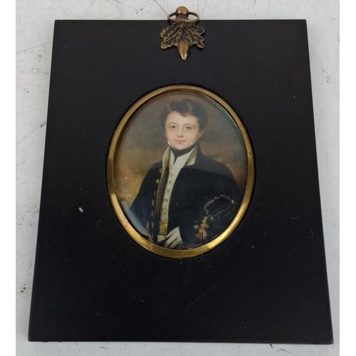 132 - Miniature print of a young boy in officer’s uniform, framed under glass with brass embellishments. O... 