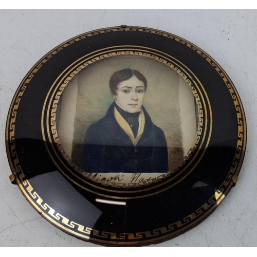 133 - Antique hand-painted miniature portrait  The portrait features a young man in early 19th-century att... 