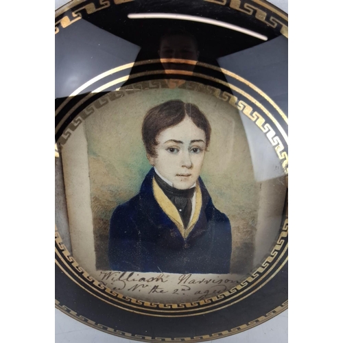 133 - Antique hand-painted miniature portrait  The portrait features a young man in early 19th-century att... 