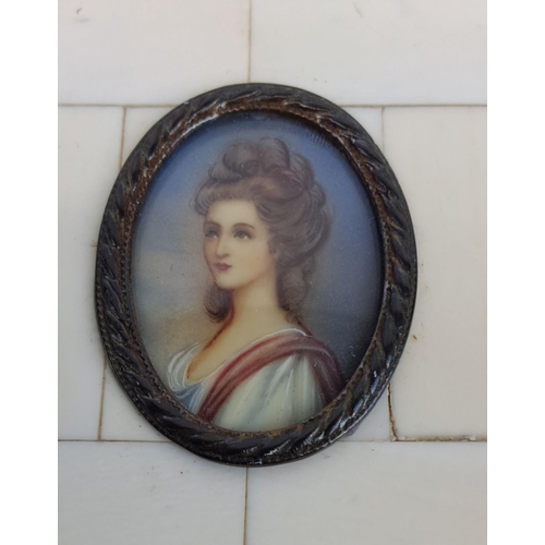 139 - Antique miniature hand painted on porcelain portrait of a Georgian lady, framed in an bone and metal... 