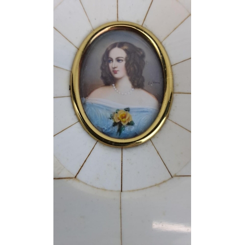 148 - Antique miniature portrait painting on porcelain  of a lady, signed, encased in a bone and gold fram... 