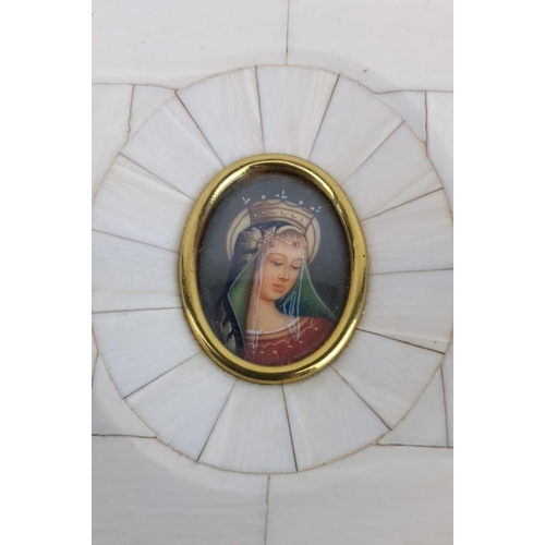 151 - Antique miniature hand-painted icon of a saint, encased in an ornate frame, measuring 10cm x 9cm.