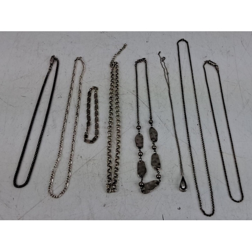 159 - Mixed lot of eight sterling silver necklaces and one bracelet, featuring various chain styles and de... 