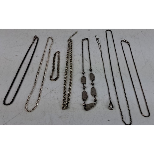 159 - Mixed lot of eight sterling silver necklaces and one bracelet, featuring various chain styles and de... 