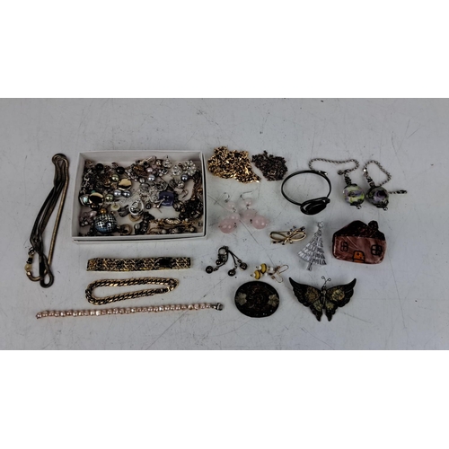 161 - Collection of assorted jewelry pieces including necklaces, earrings, bracelets, charms, and brooches... 