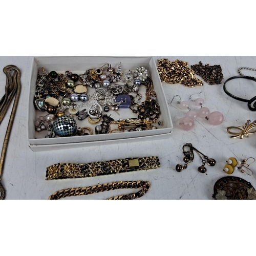 161 - Collection of assorted jewelry pieces including necklaces, earrings, bracelets, charms, and brooches... 