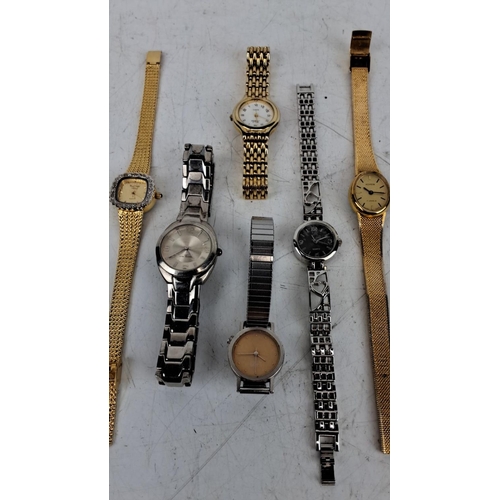 164 - Collection of six assorted wristwatches. Includes both gold-tone and silver-tone designs. Features b... 