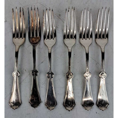 165 - Set of six ornate white metal forks. The forks feature intricate floral and scrollwork designs on th... 