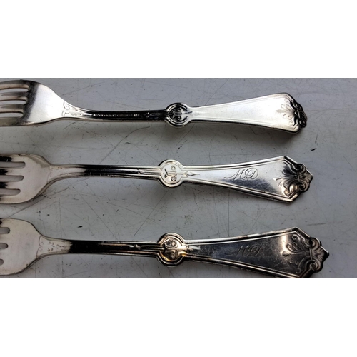 165 - Set of six ornate white metal forks. The forks feature intricate floral and scrollwork designs on th... 