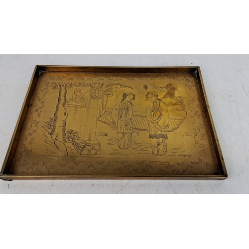 167 - Brass tray with engraved Asian scene depicting two women and a man by a tree, adorned with intricate... 