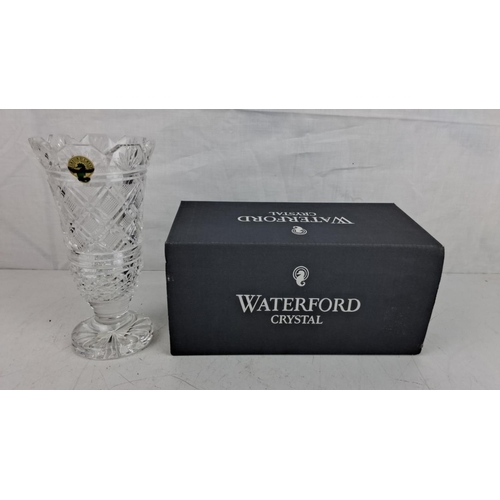 26 - Waterford Crystal vase in original box. Features intricate cut patterns and scalloped rim.