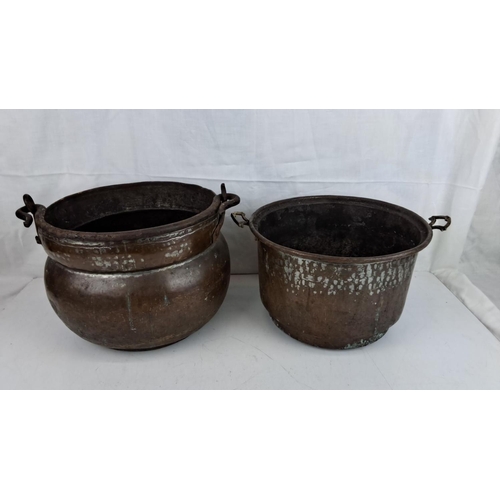 3 - Two antique copper cauldrons/plant pots with iron handles.