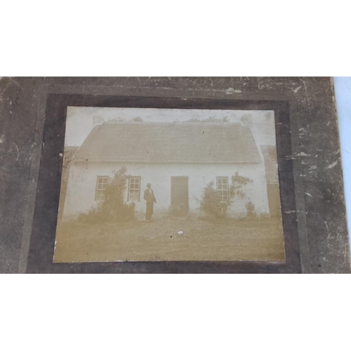 31 - Pair of vintage framed sepia photographs depicting rural Irish cottages and another unframed.