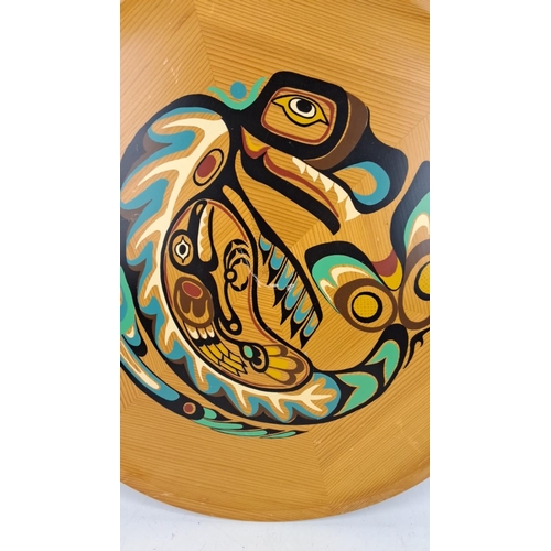 34 - Handcrafted wood tray featuring an indigenous-style painting of a serpent, accented with vibrant gre... 