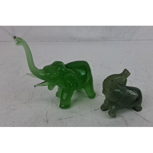 36 - Two vintage miniature jade elephants (a/f).