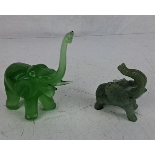 36 - Two vintage miniature jade elephants (a/f).