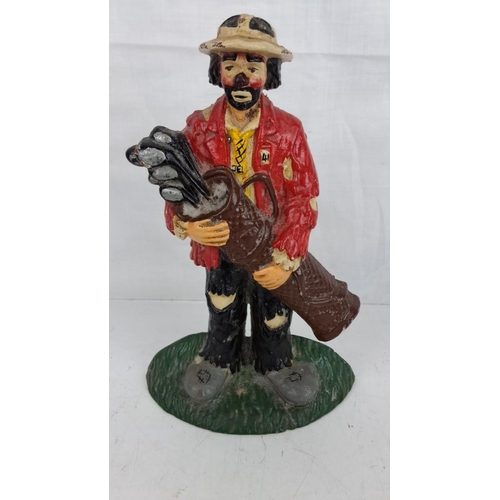 38 - Cast iron 'clown golfer' door stop.