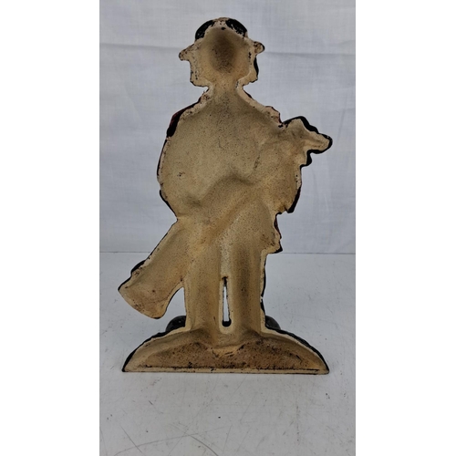 38 - Cast iron 'clown golfer' door stop.