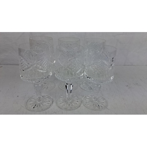 43 - Set of six Tyrone crystal wine glasses with a diamond and leaf pattern. Each glass has a sturdy, sta... 