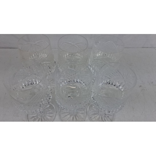 43 - Set of six Tyrone crystal wine glasses with a diamond and leaf pattern. Each glass has a sturdy, sta... 