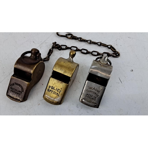 46 - Three vintage metal whistles, including 