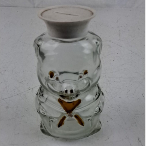 61 - Vintage glass piggy bank with a removable white cap and brown painted details.