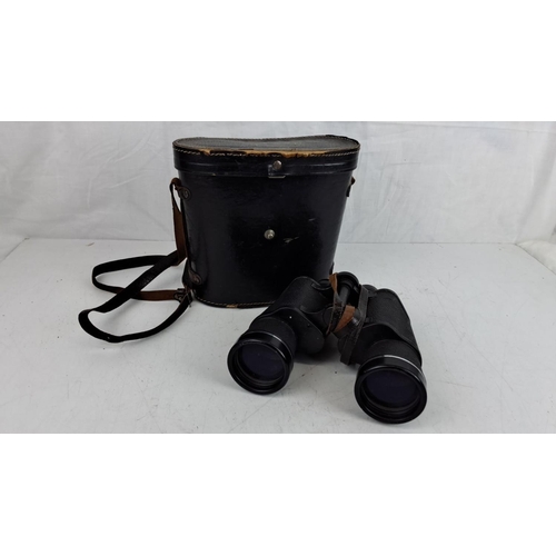 63 - Asahi Pentax 10x50 field 5.5° prism binoculars with coated optics. Includes original leather carryin... 