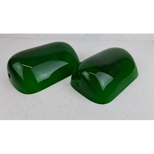 76 - Pair of green glass bankers lamp shades. Likely mid-century modern style. Smooth, glossy finish with... 