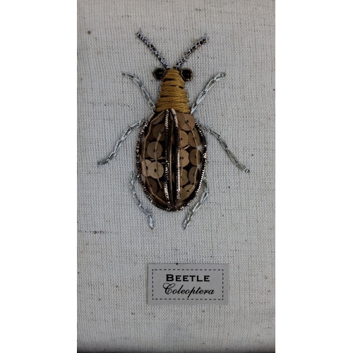 94 - Framed artwork depicting a beetle from the order Coleoptera. Meticulously crafted with metallic thre... 