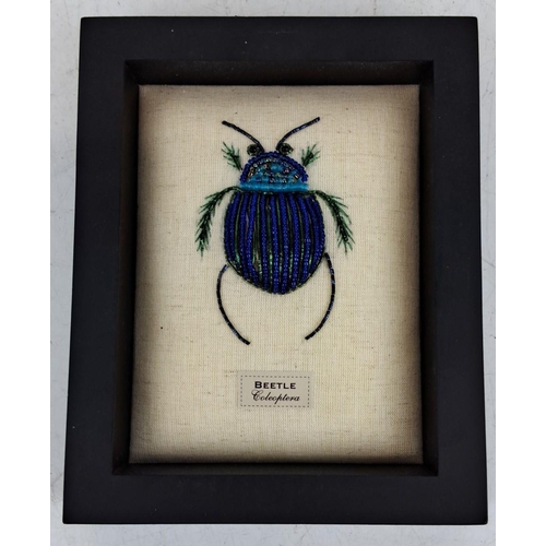 97 - Framed bead embroidery artwork featuring a beetle labeled 