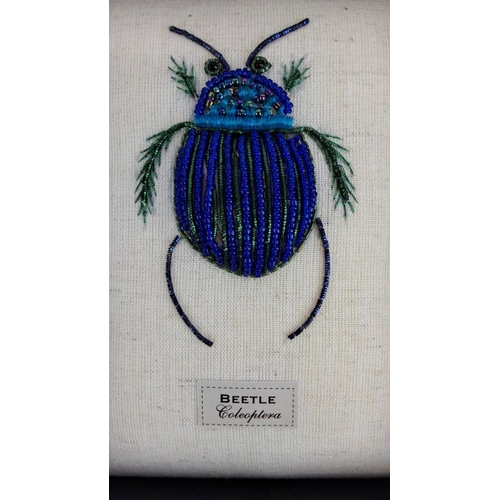 97 - Framed bead embroidery artwork featuring a beetle labeled 