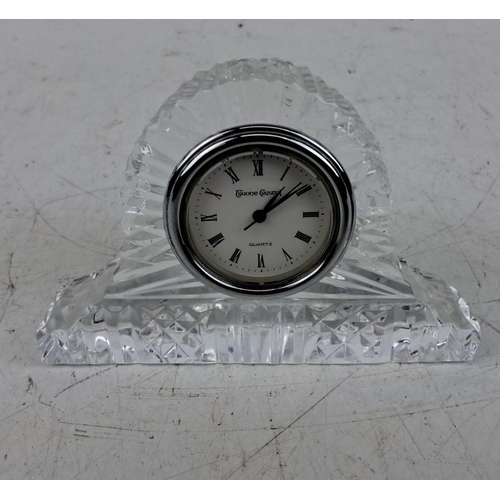 196 - Tyrone Crystal quartz clock with Roman numerals, set in a finely cut crystal base.