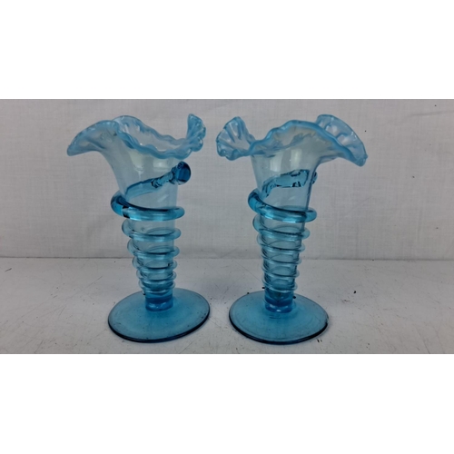 201 - Pair of blue Victorian-style art glass vases with ruffled tops and coiled designs.