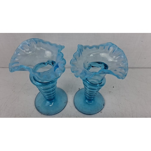 201 - Pair of blue Victorian-style art glass vases with ruffled tops and coiled designs.