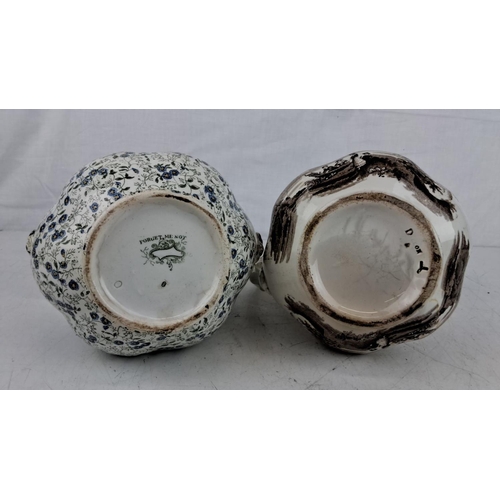 202 - Pair of 19th-century transferware pitchers. One has a floral 'Forget Me Not' design in blue and whit... 