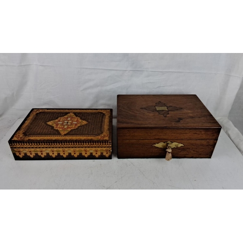 206 - Set of two decorative wooden boxes. One box features intricate inlaid details and the other has bras... 