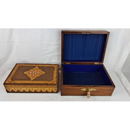 206 - Set of two decorative wooden boxes. One box features intricate inlaid details and the other has bras... 