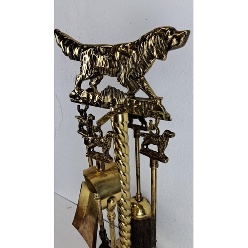 212 - Victorian brass fireplace set featuring a dog motif. Includes shovel, poker, brush, and stand. Detai... 