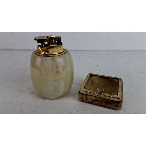 224 - Vintage onyx lighter and matching ashtray set with brass accents. 1950s design, combining natural st... 