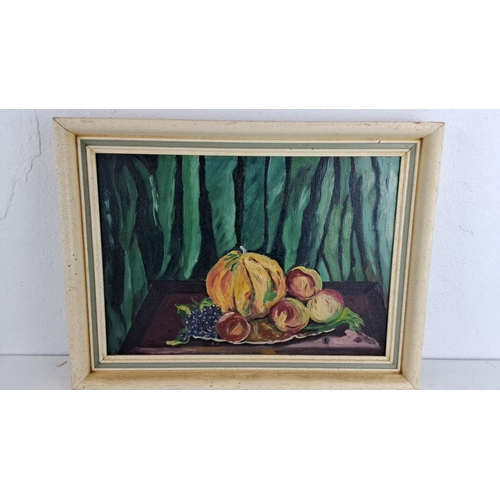 226 - Oil painting featuring a still life with a melon, peaches, and grapes. Framed in a light wood frame.... 