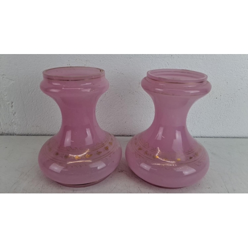 236 - Pair of vintage pink glass vases with gold floral detailing.