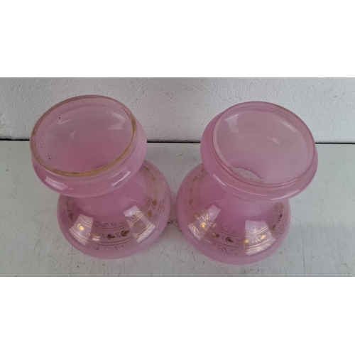 236 - Pair of vintage pink glass vases with gold floral detailing.